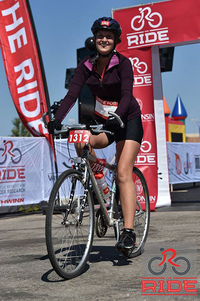Sydney Jupitz on her bike at the finish line of The Ride